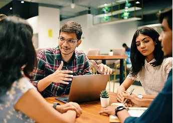 A corporate team collaborating around a table